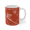 orange ceramic mug with skier slogan and fun drawings