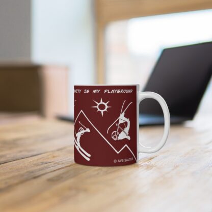 a red skiers teacup on a desk