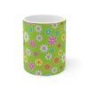 Daisy lime green ceramic cup with floral print, front view.