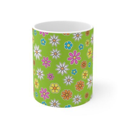 Daisy lime green ceramic cup with floral print, front view.