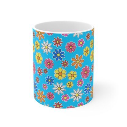 Forget Me Not blue porcelain cup with floral print, front view.