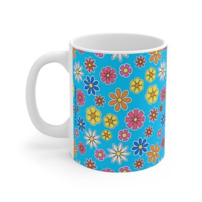 Forget Me Not blue porcelain cup with floral print, handle left.