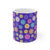 Geranium a purple porcelain cup with floral print, front view.