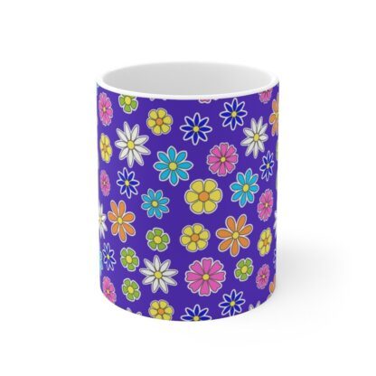 Geranium a purple porcelain cup with floral print, front view.