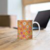 Marigold a orange porcelain cup with floral print on desk