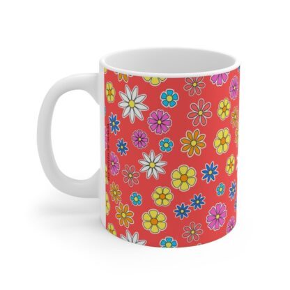 Poppy a red porcelain cup with floral print, handle left.