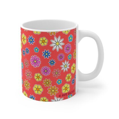 Poppy a red porcelain cup with floral print handle right.