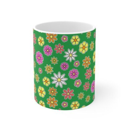 Primrose green porcelain cup with floral print, front view.