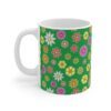 Primrose green porcelain cup with floral print, handle left.