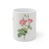 A graceful pink Marie Antoinette Rose on a white porcelain tea mug front view