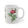 A sophisticated red Rosa Gallica on a white porcelain cup handle right