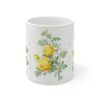 A yellow Rosa Hemisphaerica rose on a white porcelain cup front view